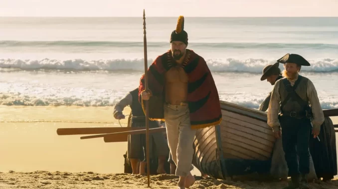 sexto-capitulo-chefe-de-guerra-traicoes-aliancas-episodio6-jpg Cena do sexto capítulo de 'Chefe de Guerra', mostrando personagens históricos em um cenário de praia, com traições e alianças decisivas no episódio 6 da série.