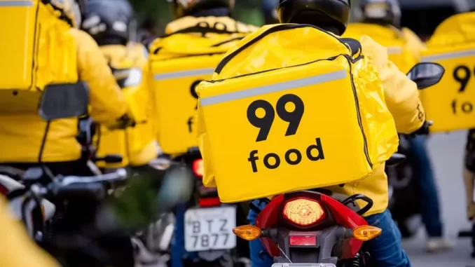99food-entregadores-expansao-investimento-2026 Repartição de entregadores do serviço de delivery da 99 Food, celebrando plano de investimento de R$ 2 bilhões até 2026 para expandir suas operações.