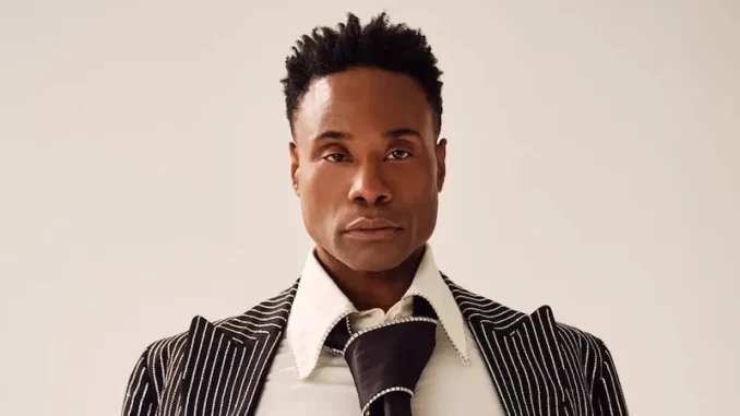 billy-porter-abandona-musical-cabaret-sepse Billy Porter abandona musical 'Cabaret' após diagnóstico grave de sepse, mostrando uma expressão séria e vestindo roupa social estilosa.