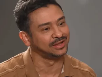 Imagem do compositor Nivardo Paz, acusado de assédio e estupro por cantoras, com expressão facial séria, em entrevista ou depoimento.