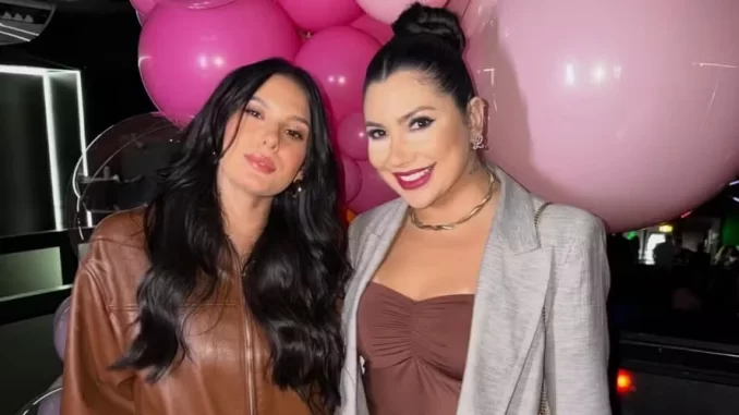 comentario-amiga-ana-castela-critica-virginia-jpg Comentário de amiga envolvendo Ana Castela em crítica a Virginia, duas mulheres sorridentes posando juntas com balões rosas ao fundo.