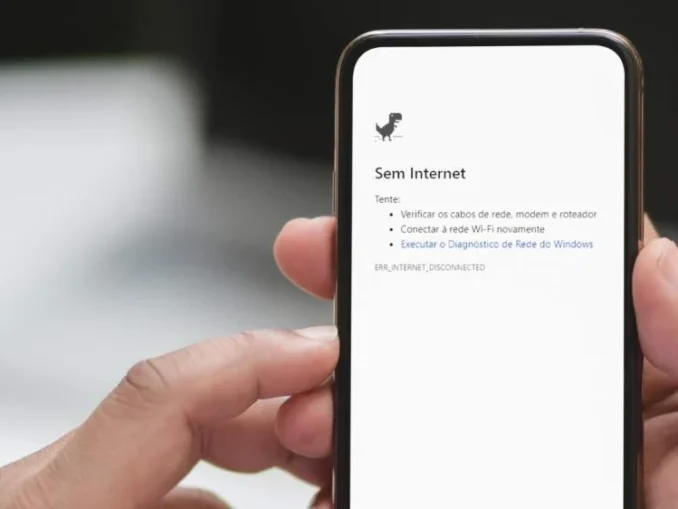 Imagem de uma pessoa segurando um smartphone com a mensagem “Sem Internet” na tela, ilustrando a proposta “Um Dia sem Internet” do Movimento Reset Day no Brasil.